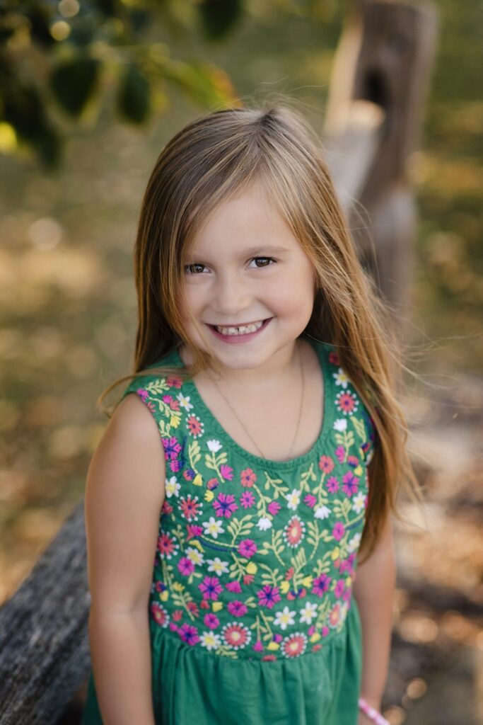 Fun portrait of little girl smiling at the camera.