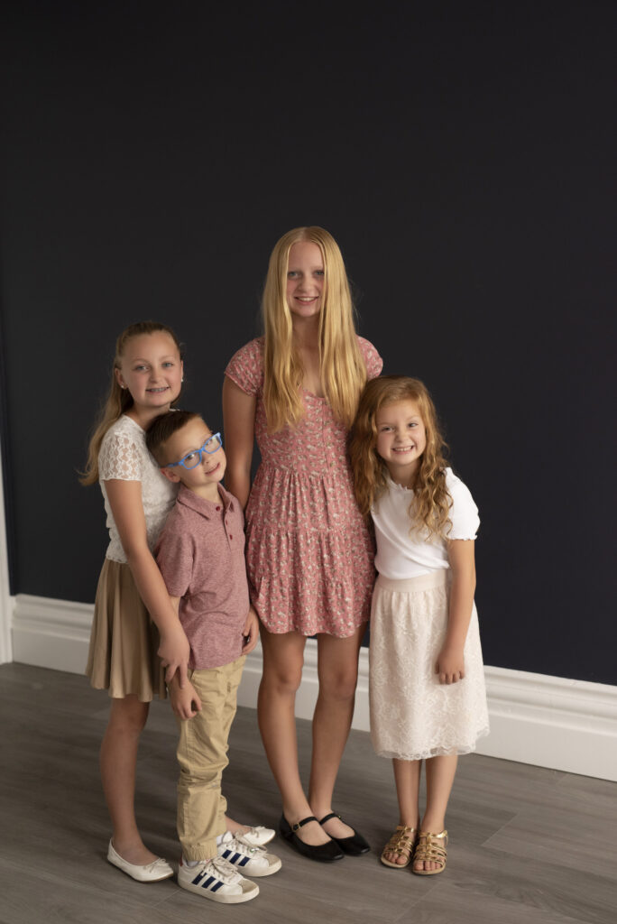 Group photo of the siblings during a family photo session.