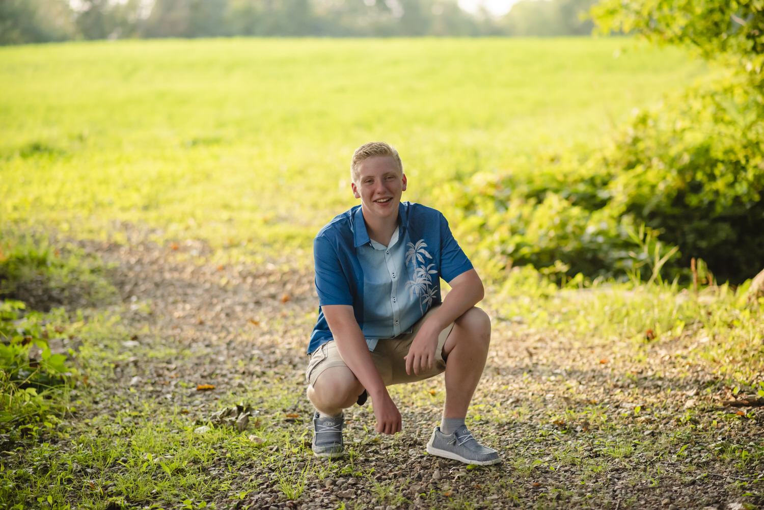 Senior portrait of young man taken on family farm.